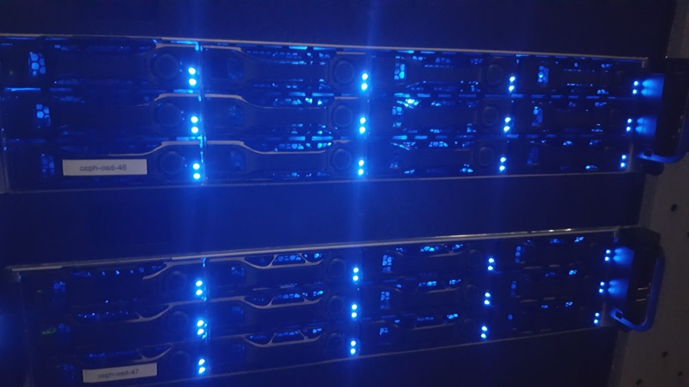 Clustered storage nodes lit blue in a UKNode rack in Manchester.
